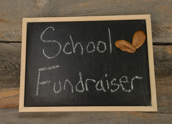 This is a photo of a blackboard with the wording school fundraiser