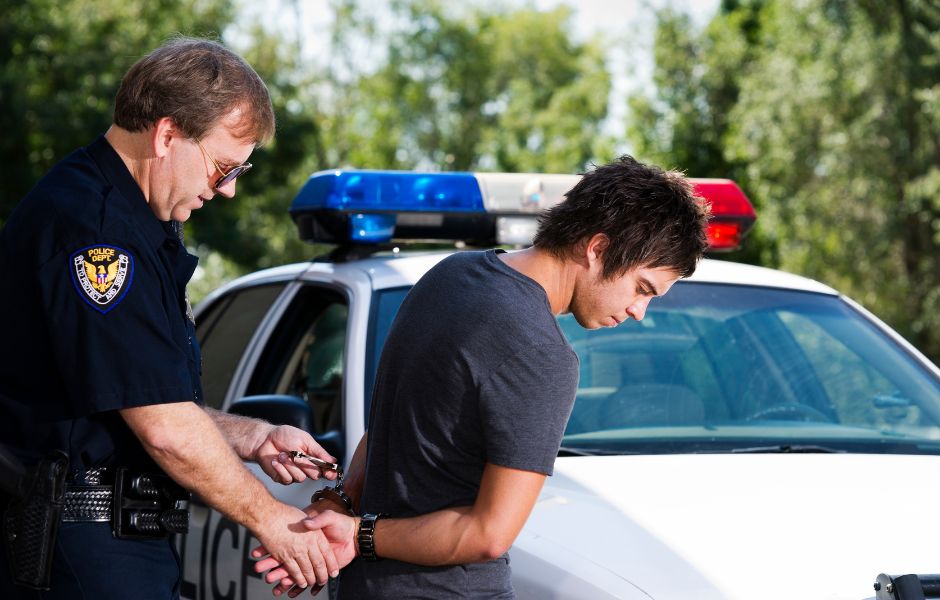 This is a photo of a guy getting arrested